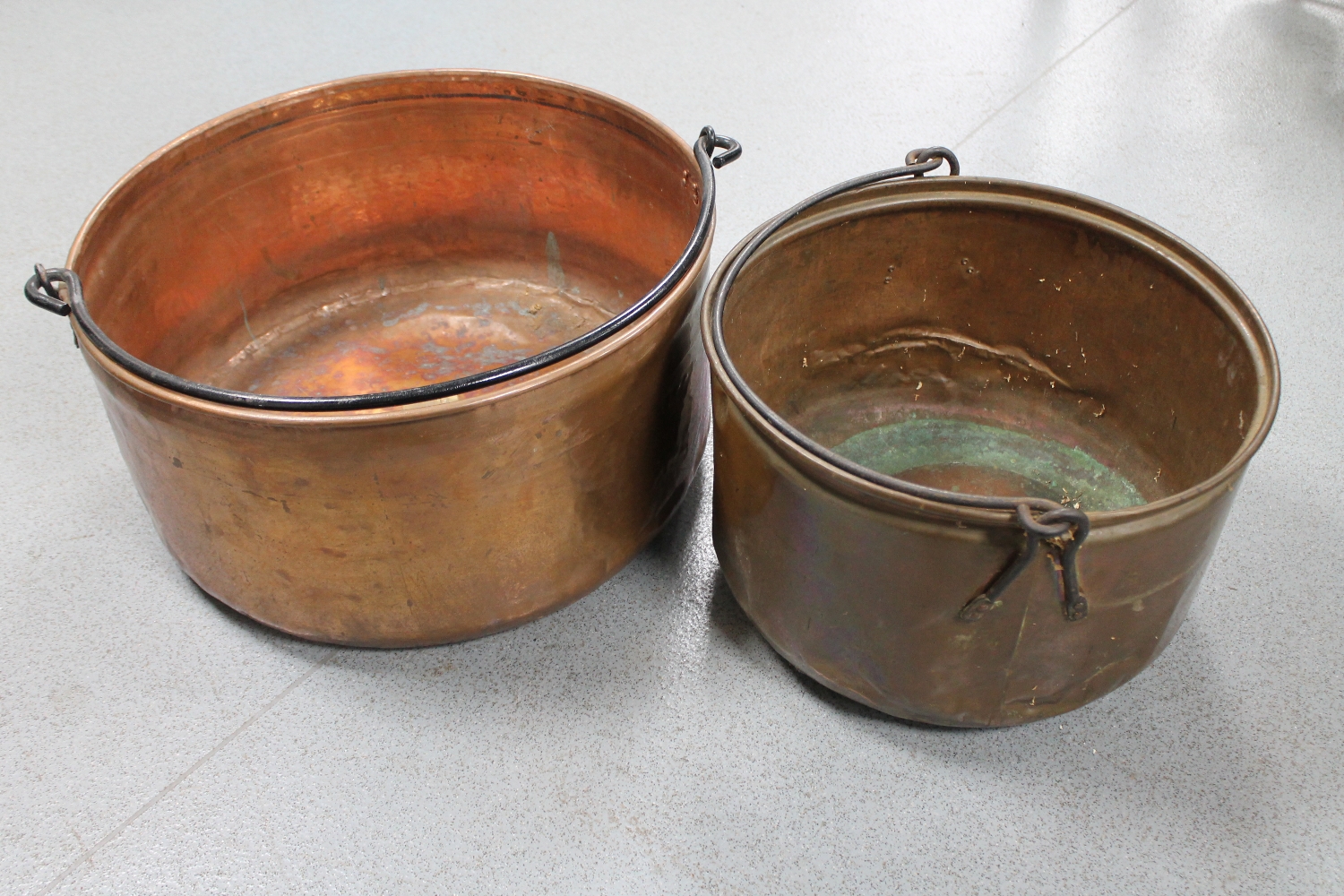 Two antique swing handled copper cooking pots