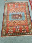 A Caucasian rug on red ground,