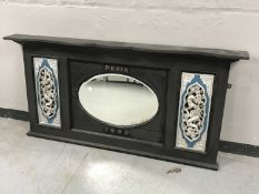 An early 20th century painted overmantel mirror with painted dragon insets