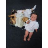 A box containing early 20th century and later dolls
