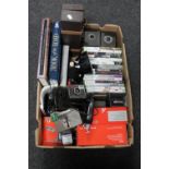 A box containing Polaroid camera, Xbox 360 games,