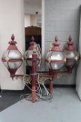 A pair of Victorian style twin driveway lights on metal posts