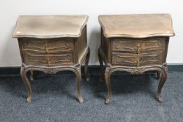 A pair of French carved beech two drawer bedside stands