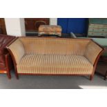 An antique mahogany framed hall settee