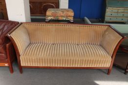 An antique mahogany framed hall settee