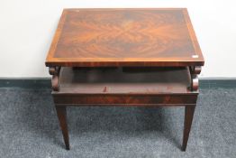 An inlaid mahogany reproduction book table