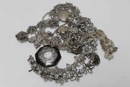 A good collection of silver and white metal jewellery, filigree bracelet, brooches, pendants,