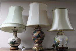 A group of five earthenware table lamps with shades