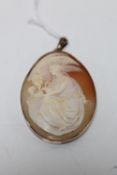 An antique 9ct rose gold cameo pendant depicting Leda and the Swan