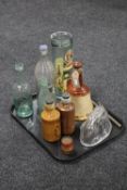 A tray containing antique stoneware and glass bottles, an antique glass jelly mould of a rabbit,