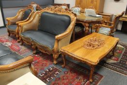 An oriental style carved, high gloss lounge suite comprising of three seater settee,