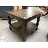 A contemporary two tier lamp table