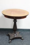 A late 19th century continental mahogany oval pedestal work table