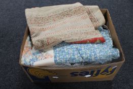 A box containing antique and later bed linen, quilts,