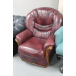 A Burgundy leather armchair