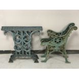 A pair of cast iron bench ends and a pair of cast iron table bases