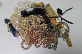 A bag of costume jewellery, lady's wristwatches, simulated pearls,