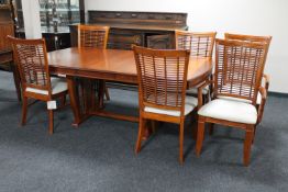 A Colonial style pedestal extending table with leaf and six dining chairs
