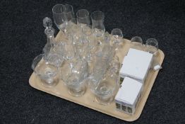 A tray of wine glasses, grapefruit dishes,