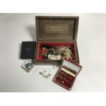 An Eastern trinket box containing costume jewellery and wristwatches,