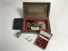 An Eastern trinket box containing costume jewellery and wristwatches,