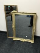 An ornate gilt framed mirror and a hall mirror