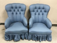 A pair of Victorian style lady's chairs in blue buttoned fabric