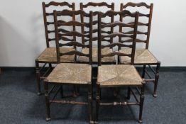 A set of five antique oak ladder back country kitchen chairs