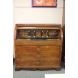 A 19th century continental oak cylinder bureau,