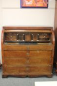 A 19th century continental oak cylinder bureau,