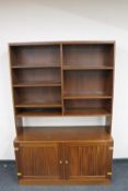 A 20th century mahogany bookcase fitted double door cupboards beneath