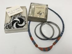 A costume necklace and two matching bangles, a Canadian beadwork necklace,