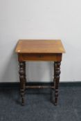 A 19th century walnut work table