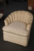 A tub chair in cream fabric