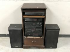 A Technics hi/fi in cabinet with speakers