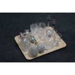 A tray of cut glass perfume bottles with stoppers, pair of glass candlesticks,