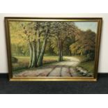 A gilt framed continental school oil on canvas - Path through woodland signed A.