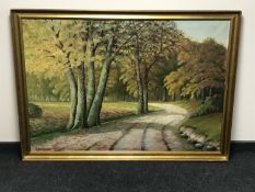 A gilt framed continental school oil on canvas - Path through woodland signed A.