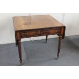 A 19th century mahogany flap sided table on turned legs