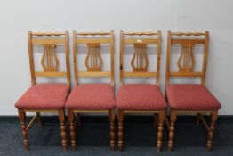 A set of four contemporary pine dining chairs
