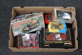 A box of assorted boxed die cast vehicles - Burago Chevrolet, Maisto corvette,