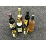 A tray of seven bottles of alcohol including Cider, Chardonnay,