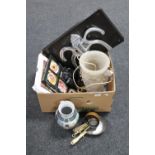 A box containing cherub table lamp, miniature brass pans, binoculars,