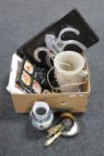 A box containing cherub table lamp, miniature brass pans, binoculars,