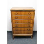 A mid 20th century continental walnut six drawer chest