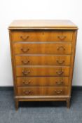 A mid 20th century continental walnut six drawer chest