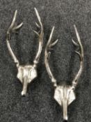 Two cast metal antler coat hooks