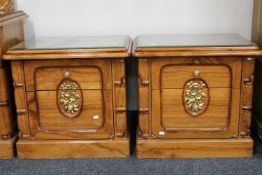 A pair of oriental style parcel gilt two drawer bedside chests