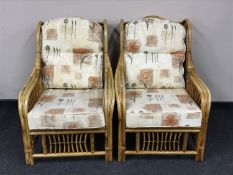 A pair of bamboo conservatory armchairs