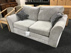 A two seater bed settee in grey fabric